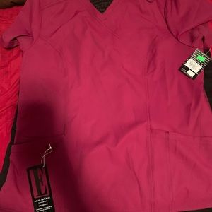 Two scrub tops and one pair of scrub pants